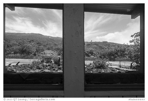 Haleakala slopes and road, Park Headquarters Visitor Center window reflexion. Haleakala National Park (black and white)