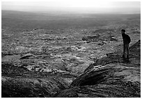 Hiker on top of Mauna Ulu crater. Hawaii Volcanoes National Park ( black and white)