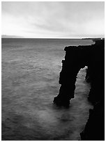 Holei sea arch at sunset. Hawaii Volcanoes National Park ( black and white)