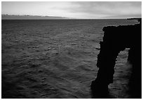 Holei sea arch at sunset. Hawaii Volcanoes National Park, Hawaii, USA. (black and white)