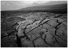 Fresh lava with cracks showing molten lava underneath. Hawaii Volcanoes National Park ( black and white)