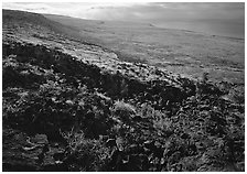 Black lava and coastal plain from Hilana Pali. Hawaii Volcanoes National Park ( black and white)