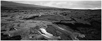 Volcanic landscape with molten lava low. Hawaii Volcanoes National Park (Panoramic black and white)