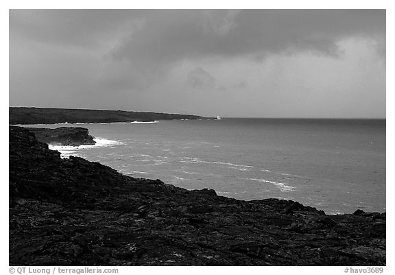 Coast covered with hardened lava and approaching storm. Hawaii Volcanoes National Park (black and white)