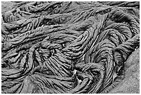 Braids of pahoehoe lava with red hot lava showing through cracks. Hawaii Volcanoes National Park, Hawaii, USA. (black and white)