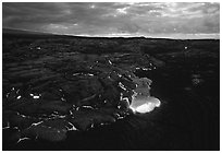 Red lava glows at dawn. Hawaii Volcanoes National Park ( black and white)