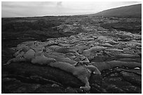 Live lava flow at sunset near the end of Chain of Craters road. Hawaii Volcanoes National Park, Hawaii, USA. (black and white)