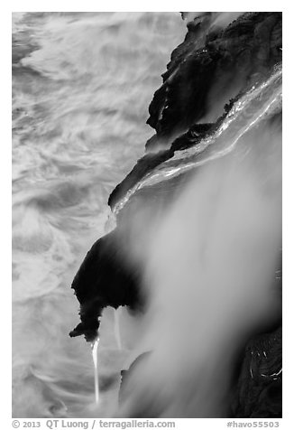 Ribbons of lava flow into the Pacific Ocean. Hawaii Volcanoes National Park (black and white)