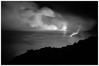 Hydrochloric steam clouds glow by lava light on coast. Hawaii Volcanoes National Park ( black and white)