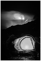 Camping by lava flow next to ocean. Hawaii Volcanoes National Park, Hawaii, USA. (black and white)