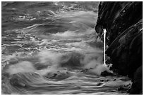 Waves and lava spigot. Hawaii Volcanoes National Park ( black and white)