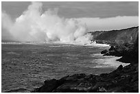 Clouds of smoke and steam produced by lava flowing into ocean. Hawaii Volcanoes National Park ( black and white)