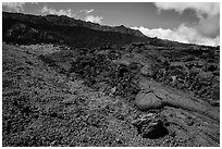 Olivine crystals, red lava rock, and lava fields, Mauna Loa. Hawaii Volcanoes National Park, Hawaii, USA. (black and white)