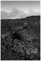 Red and orange lava, rainbow in clouds, Mauna Loa. Hawaii Volcanoes National Park ( black and white)
