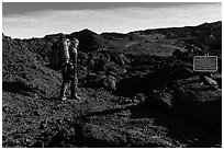 Backpacker entering park through Observatory Trail. Hawaii Volcanoes National Park ( black and white)