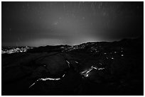 Molten lava flow with star trails. Hawaii Volcanoes National Park, Hawaii, USA. (black and white)