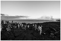 Large group of people at lava viewing area. Hawaii Volcanoes National Park ( black and white)