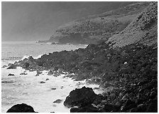 Coastline with Balsalt boulders on the wild South coast of Tau Island. National Park of American Samoa ( black and white)