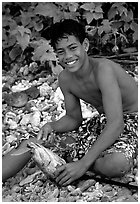 Samoan boy with fish, Tau Island. National Park of American Samoa ( black and white)