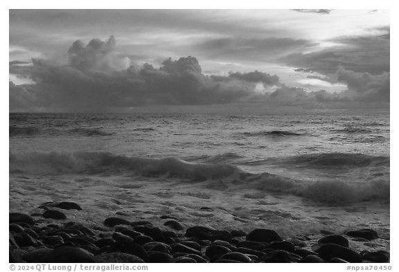 Boulders, surf, and clouds at sunrise. National Park of American Samoa (black and white)