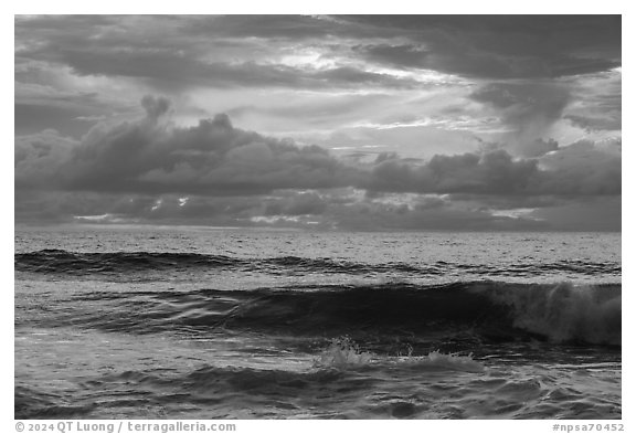 Surf and tropical clouds at sunrise from Tuitula Island. National Park of American Samoa (black and white)