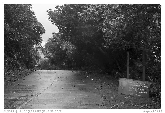 Park sign and road, Ofu Island. National Park of American Samoa (black and white)