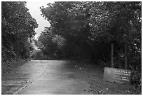 Park sign and road, Ofu Island. National Park of American Samoa ( black and white)