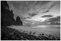 Pola Island, Boulders, surf, and clouds at sunrise. National Park of American Samoa ( black and white)