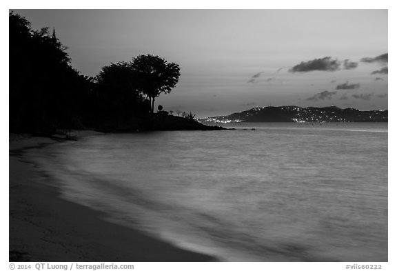 Honeymoon beach at dusk with lights of St Thomas. Virgin Islands National Park (black and white)