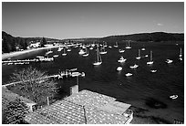 Yatchs anchored in the outskirts of the city. Sydney, New South Wales, Australia ( black and white)