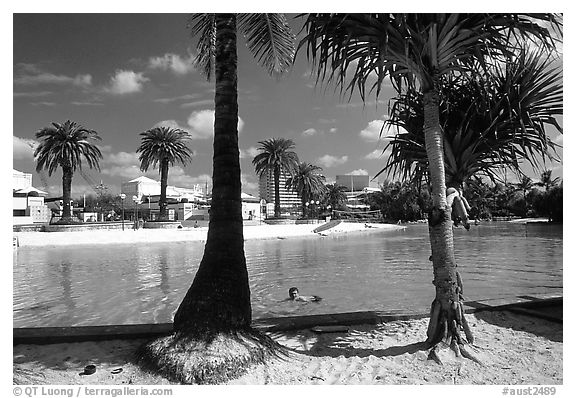 Artificial beach, complete with sand and palm trees. Brisbane, Queensland, Australia (black and white)