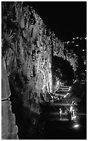Rock climbing on the banks of the Brisbane River at night. Brisbane, Queensland, Australia ( black and white)