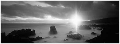 Seascape with mystic sun and rays. Maui, Hawaii, USA (Panoramic black and white)