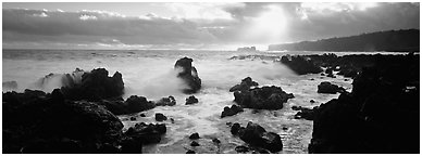 Seascape with jagged rocks and surf. Maui, Hawaii, USA (Panoramic black and white)