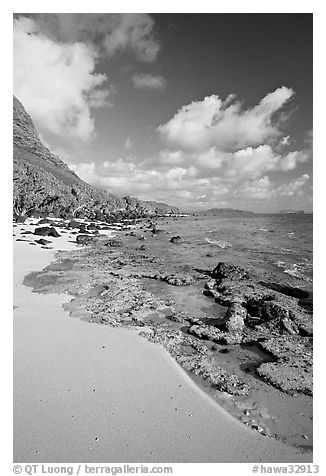 Beach and rocks near Makai research pier,  early morning. Oahu island, Hawaii, USA (black and white)