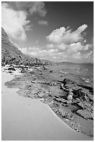 Beach and rocks near Makai research pier,  early morning. Oahu island, Hawaii, USA ( black and white)