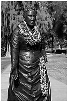 Statue of queen with fresh flower leis. Waikiki, Honolulu, Oahu island, Hawaii, USA ( black and white)