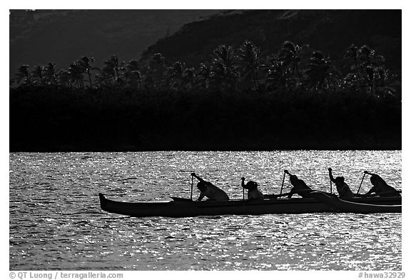 Backlit outrigger canoe, Maunalua Bay, late afternoon. Oahu island, Hawaii, USA (black and white)