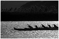 Backlit outrigger canoe, Maunalua Bay, late afternoon. Oahu island, Hawaii, USA (black and white)