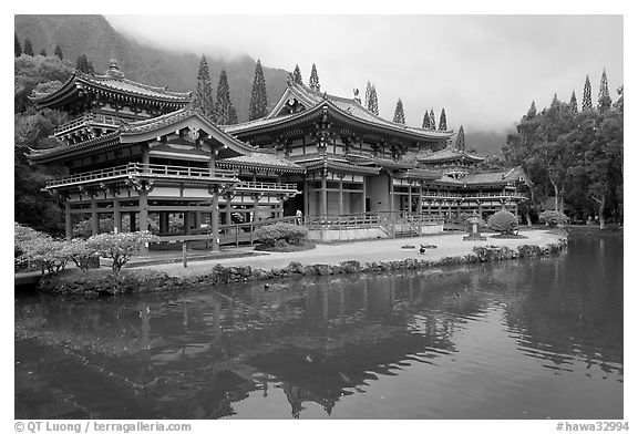 Byodo-In temple reflected in pond on a cloudy day. Oahu island, Hawaii, USA (black and white)