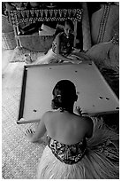 Fiji women playing a traditional game similar to pool. Polynesian Cultural Center, Oahu island, Hawaii, USA (black and white)
