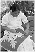 Woman quilting. Polynesian Cultural Center, Oahu island, Hawaii, USA (black and white)