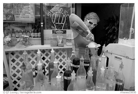 Woman preparing a cup of shave ice. Waikiki, Honolulu, Oahu island, Hawaii, USA