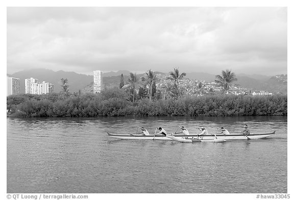 Outrigger canoe along the Ala Wai Canal. Waikiki, Honolulu, Oahu island, Hawaii, USA (black and white)
