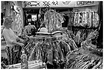 Woman shopping hawaiian dresses. Waikiki, Honolulu, Oahu island, Hawaii, USA (black and white)