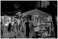 Shoppers amongst craft stands, International Marketplace. Waikiki, Honolulu, Oahu island, Hawaii, USA ( black and white)