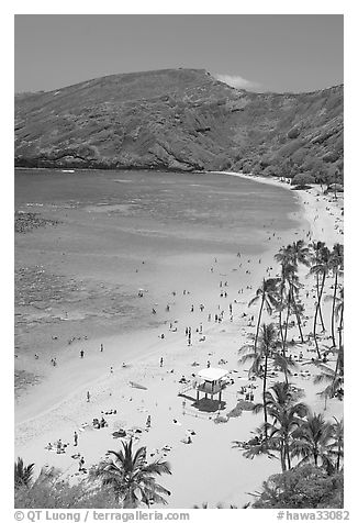 Hanauma Bay beach with people. Oahu island, Hawaii, USA (black and white)