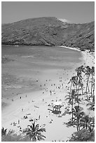 Hanauma Bay beach with people. Oahu island, Hawaii, USA (black and white)