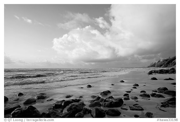 Boulders, beach and clouds, Lydgate Park, sunrise. Kauai island, Hawaii, USA (black and white)