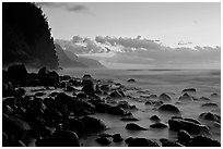 Boulders, surf, and Na Pali Coast, Kee Beach, dusk. Kauai island, Hawaii, USA ( black and white)